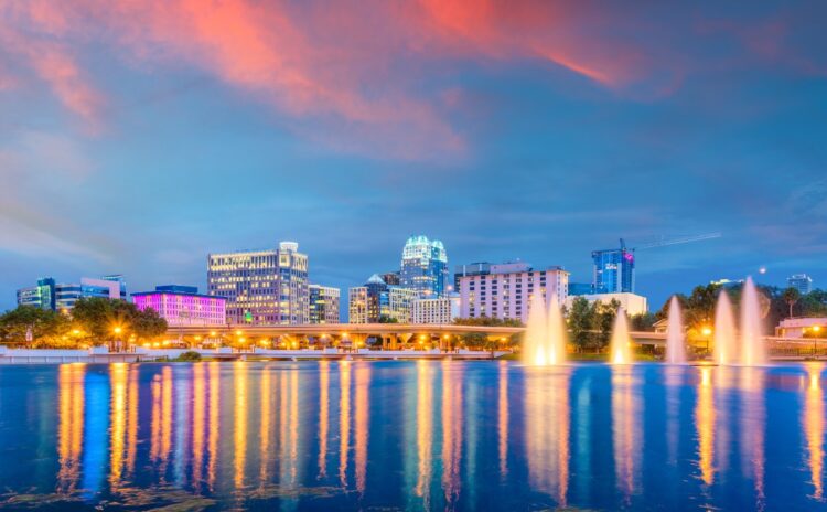 Orlando, Florida, USA aerial cityscape towards Lake Eola at dusk.